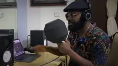 Falz carry mic dey record music