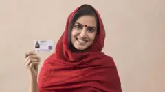 ஆதார் அட்டை, இந்தியா, வரி