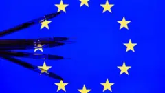 Seringas sobre a bandeira da União Europeia