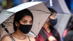 వర్షంలో యువతి