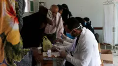 doctor offers poor persons free medical treatments