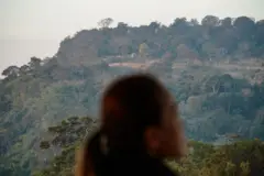 SISAKET, THAILAND - 2025/01/06: A local Thai looks on the Preah Vihear castle of Cambodia at the Mo I Daeng cliff in Sisaket. (Photo by Seksan Rochanametakul/SOPA Images/LightRocket via Getty Images)