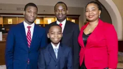 Tanitoluwa "Tani" Adewumi and family