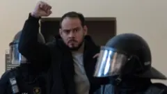 Catalan rap singer Pablo Hasel is detained by riot police inside the University of Lleida