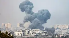 Smoke rises from the northern part of the Gaza Strip as a result of an Israeli airstrike, at an undisclosed location near the border with Gaza, in Israel, 28 October 2023.