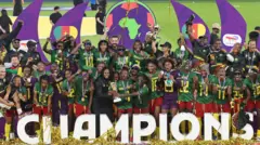 Cameroon celebrate with the Wafcon trophy
