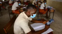 Student wit calculator writing exams
