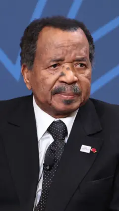Paul Biya in black suit