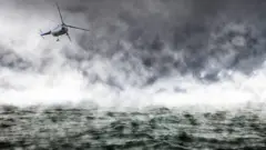 Foto of helicopter wey dey fly over di Atlantic Ocean