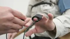 Man receiving polygraph