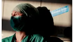 An intensive care nurse takes a break in Brussels, Belgium, 24 April 2020