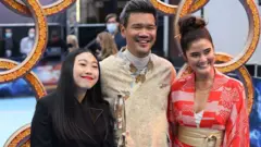 Awkwafina, Destin Daniel Cretton and sister Joy Cretton arriving for the UK premiere of Marvel Studio"s Shang-Chi at Curzon Mayfair, central London. Picture date: Thursday August 26, 2021.