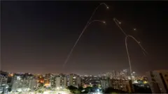 Iron Dome anti-missile system fires interception missiles as rockets are launched from Gaza towards Israel, as seen from the city of Ashkelon, Israel, 13 November, 2019.