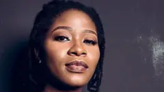 Kiki Mordi na journalist