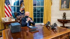 Joe Biden in the Oval office on 20 January 2021