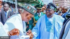 Tinubu àti Shettima ń kí ara wọn 