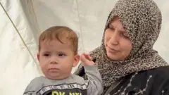 أم فلسطينية نزحت خلال حرب إسرائيل على غزة
