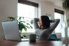 Young woman taking a break while working at home - stock photo