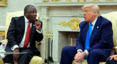 President of South Africa Cyril Ramaphosa (L) and U.S. President Donald Trump exchange words in Oval office