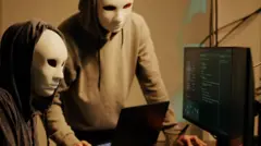 তথ্য চুরি করছে মুখোশ পরা দুইজন হ্যাকার 