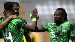 Moses Simon wit high five for Iheanacho