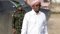 Guinea-Bissau president Umaro Sissoco Embaló on white wit securiti man for im back