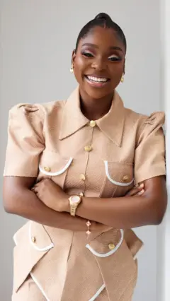 A woman posing and smiling for the camera