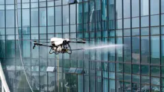 A drone spraying water 