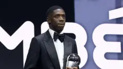 Di Best Fifa Men's Player winner, Ousmane Dembele dey stage wit di trophy