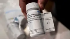 Close up image shows a pill bottle labelled daraxonrasib, in view are some of the label contents such as '300 mg' and 'by mouth daily for 21 days'.