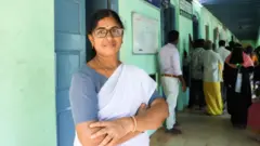 Kathija standing in her clinic 