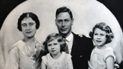 A formal portrait of the-then Duchess of York, Princess Margaret, the Duke of York - later King George VI - and Princess Elizabeth