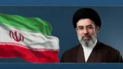 Фото Моджтаби Хаменеї в тюрбані біля іранського прапора