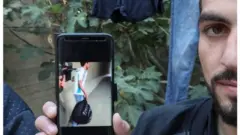 Qawasmi showing the video of his attack