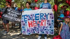 Pro-life protesters stand near the gate of the Texas state capitol at a protest outside the Texas state capitol on 29 May 2021 in Austin, Texas
