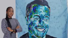 Solomon Chidinmma Miracle stand in front of her work
