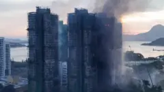 Трагедиядан кийинки таңда күйүп кеткен турак жай комплекси (Дрондон тартылган).