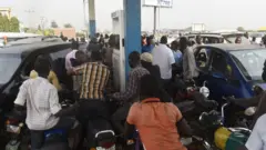 Pipo gather for filling station to buy petrol
