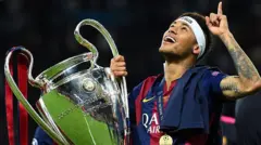 Neymar holds the Champions League trophy