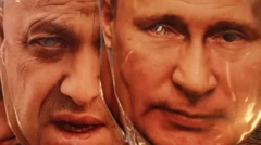 Máscaras de papel de putin e líder do grupo Wagner