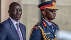 William Ruto (L) and Chief of Kenya Defence Forces General Francis Ogolla (R) look on while inspecting a guard of honour by members of di Kenya Defence Forces (KDF) during im official state visit to State House for Nairobi, on February 28, 2024. 