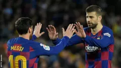 Lionel Messi and Gerard Pique