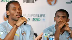 Ivorian football player Didier Drogba (L) and Cameroonian Samuel Eto'o take part in a press conference during the Africa Unity Experience at Michel Hidalgo stadium in Saint-Gratien, near Paris on May 28, 2010