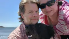 Ray Lewis (l) with his wife Sierra and service dog Mia