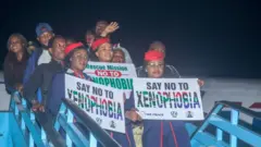 Di first set of pipo wey goment help to come back from South Africa land on Wednesday.