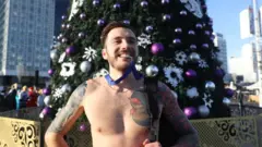A competitor in Minsk's annual 1 January "Sobriety Run" enjoying warmer than usual temperatures