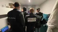 Police conducting a raid