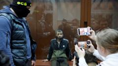 Uno de los detenidos durante su presentación ante tribunales.