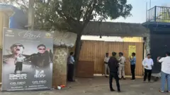 Officials outside the Birch nightclub in India