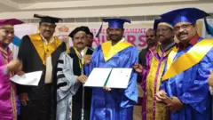 గౌరవ డాక్టరేట్ అందుకుంటున్న శ్రీనివాస్ గౌడ్
